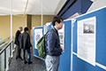 workshop attendees walking around and looking at the posters
